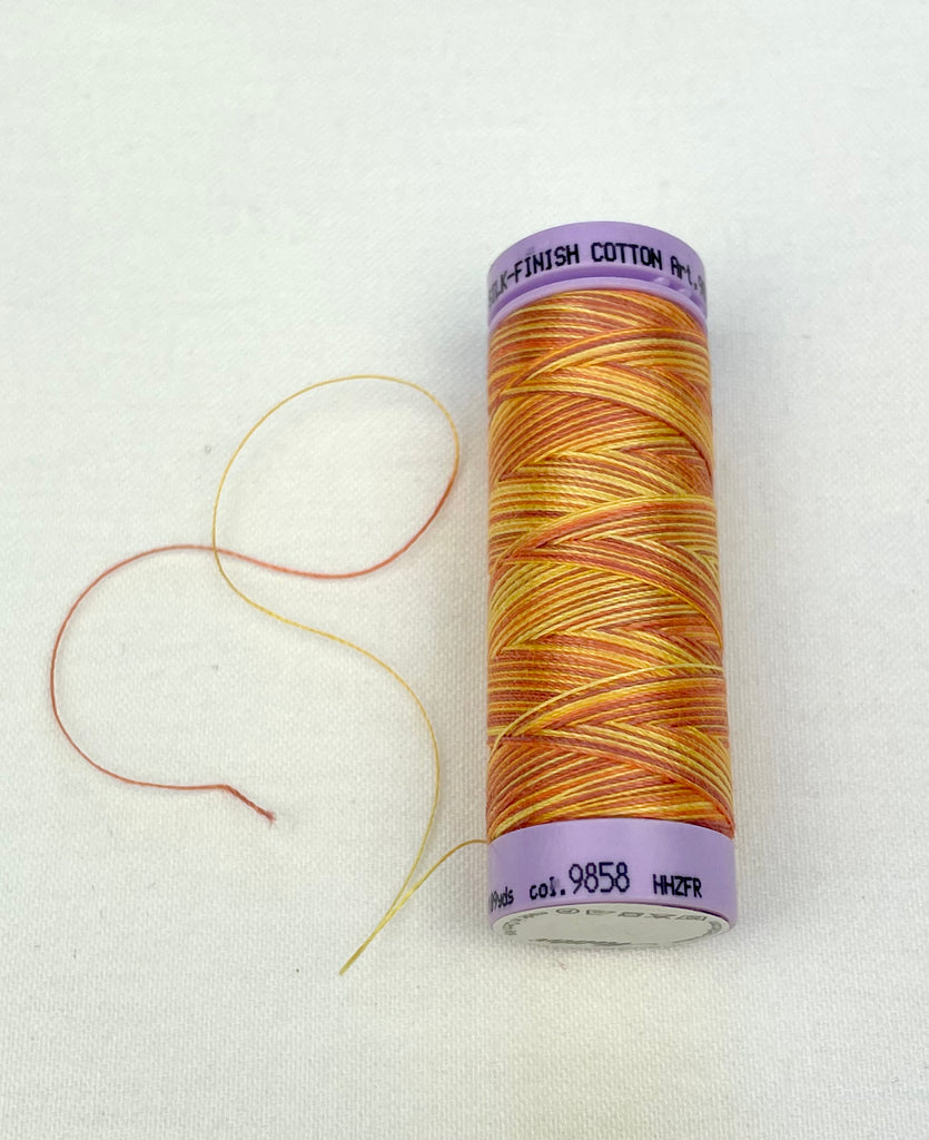 Small Burnt Orange Variegated Mettler Thread 9858 - 100m